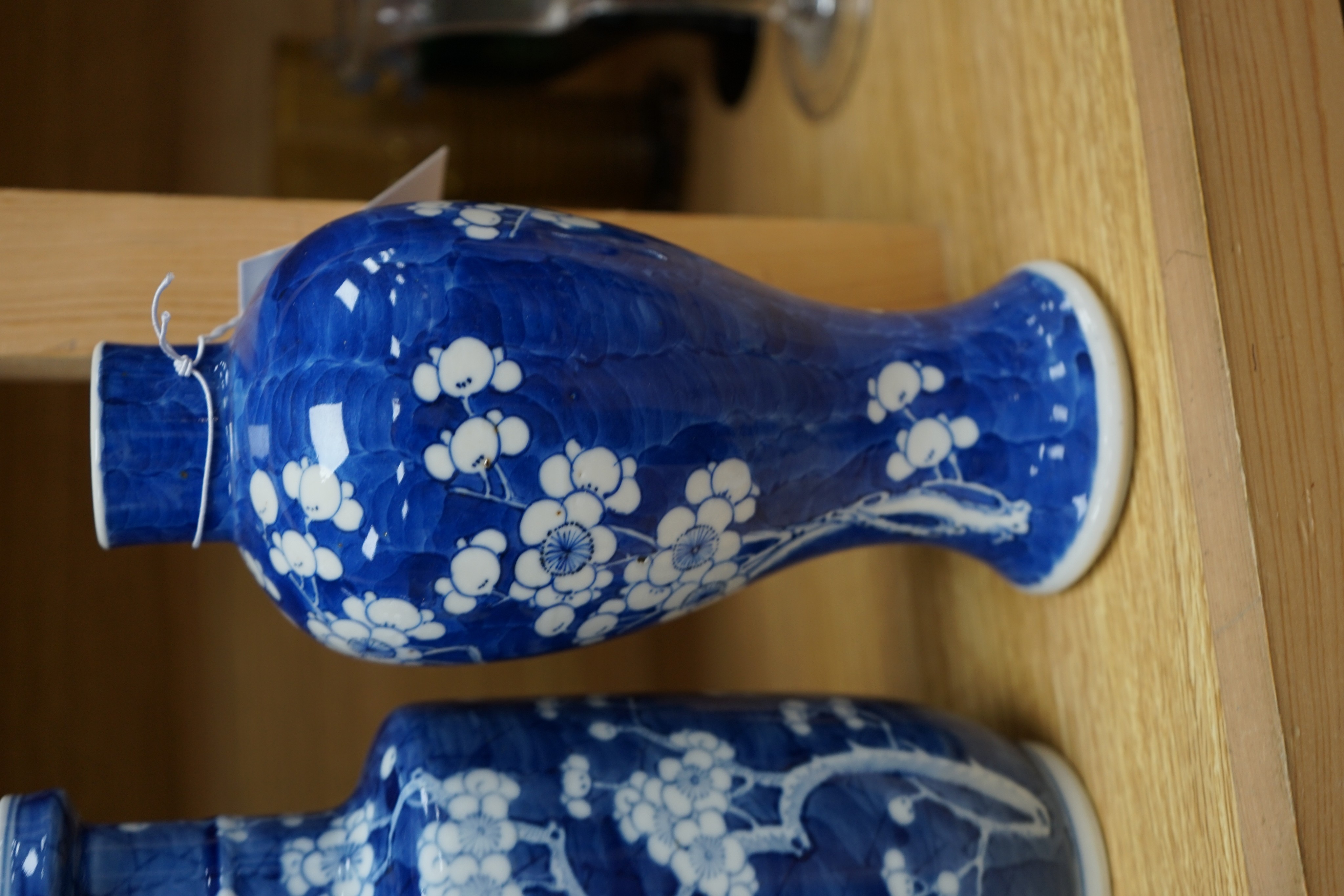 Three Chinese blue and white prunus vases. 25.5cm